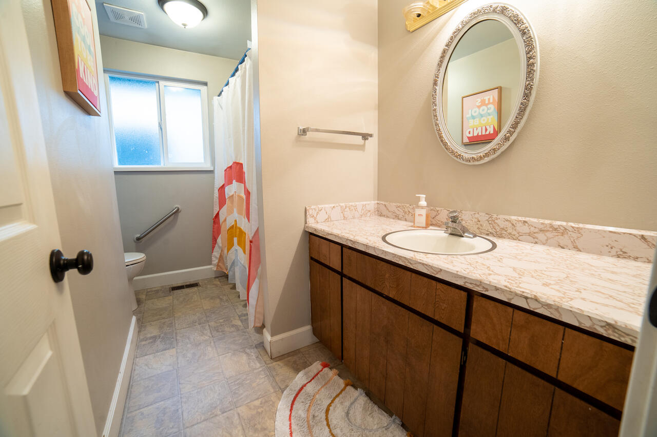 63410 Hamehook Road Bend, OR 97701 - Photo 24 of 35 a bathroom with a sink and a mirror
