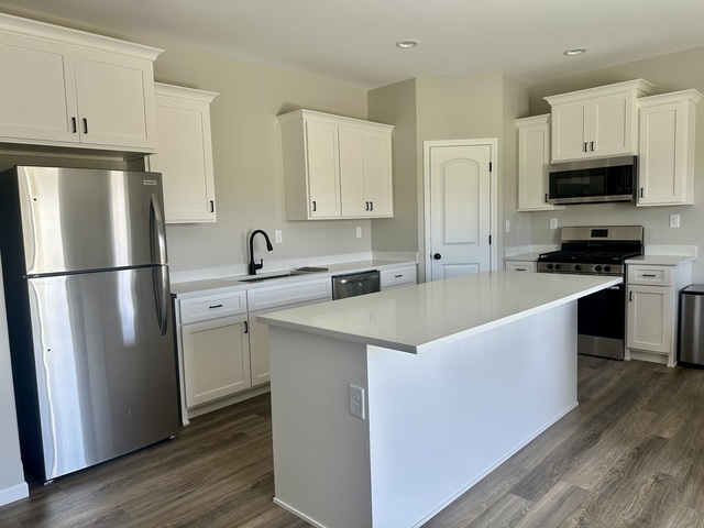 1323 Sioux Turn Kankakee, IL 60901 - Photo 6 of 15 a kitchen with stainless steel appliances a refrigerator stove and sink
