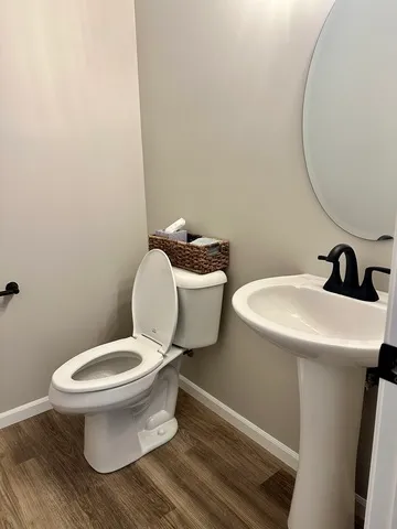 a bathroom with a toilet and a sink