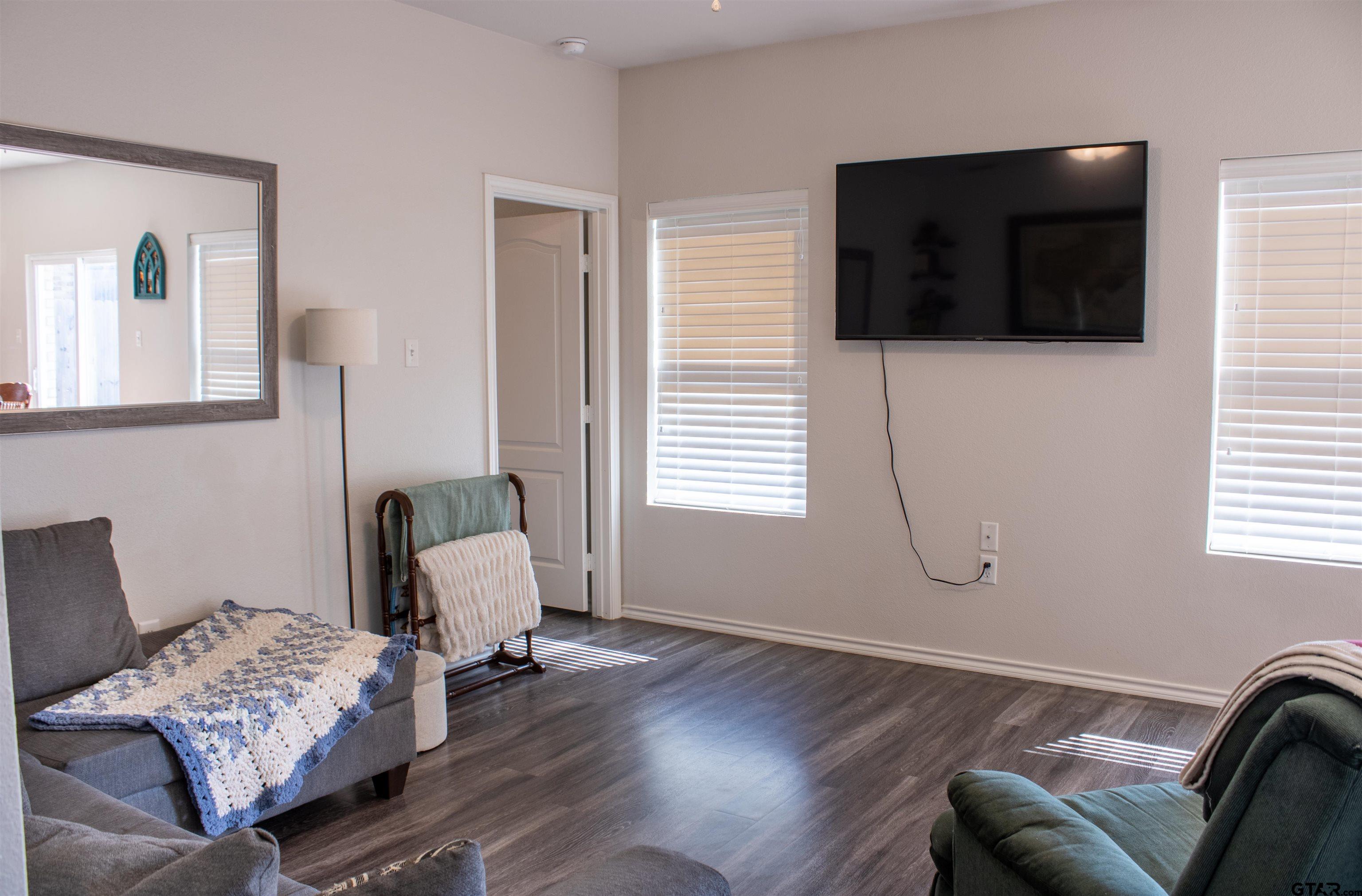 17482 Stacy Street Lindale, TX 75771 - Photo 5 of 12 a living room with furniture and a flat screen tv