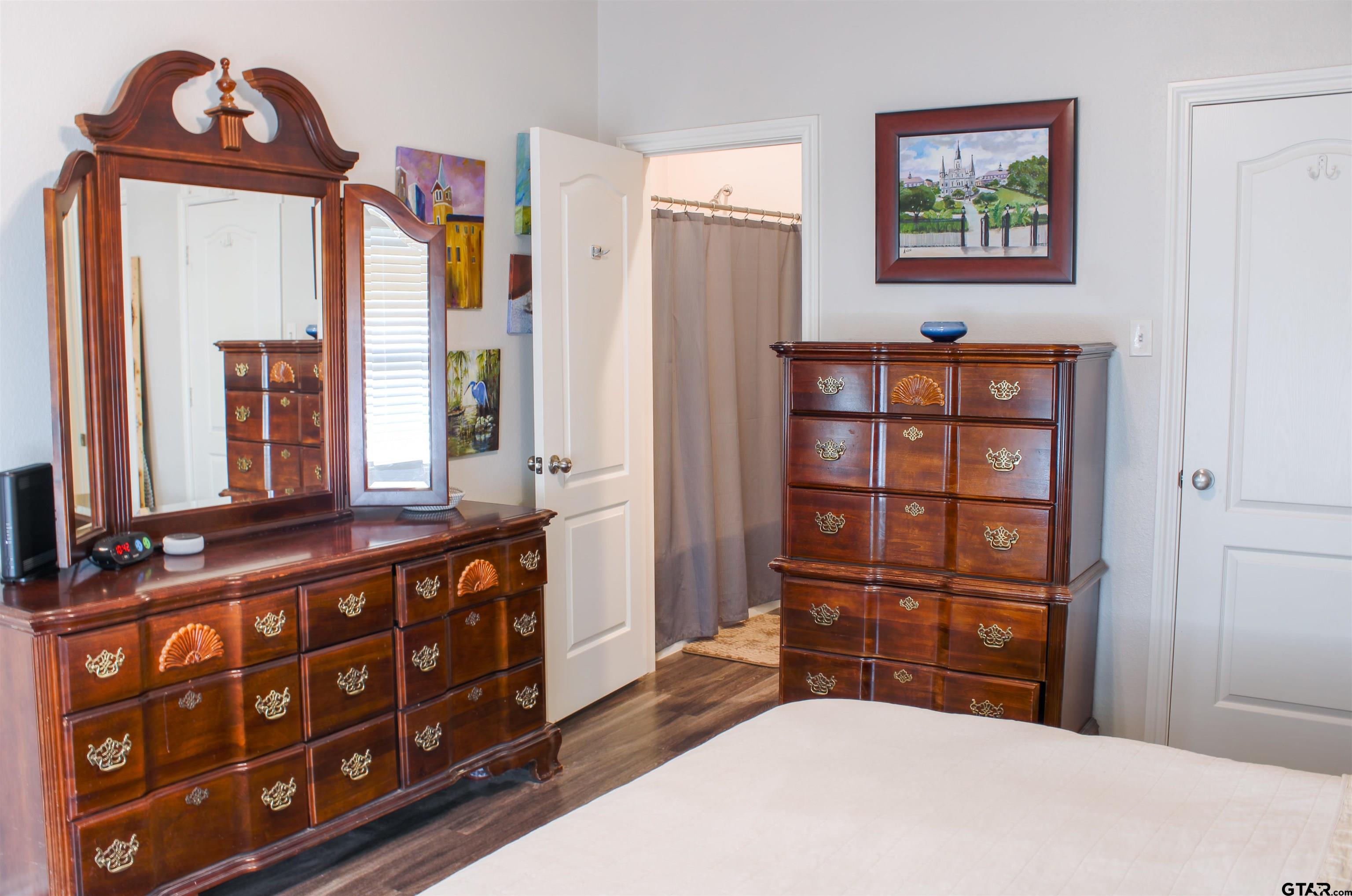 17482 Stacy Street Lindale, TX 75771 - Photo 7 of 12 a bedroom with a bed a dresser and a window
