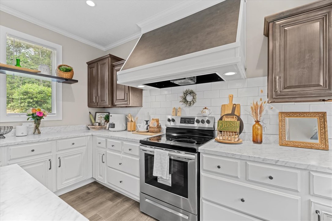 116 Parkview Road Iva, SC 29655 - Photo 16 of 44 Culinary delights await in this bright kitchen with modern appliances and ample countertop space.