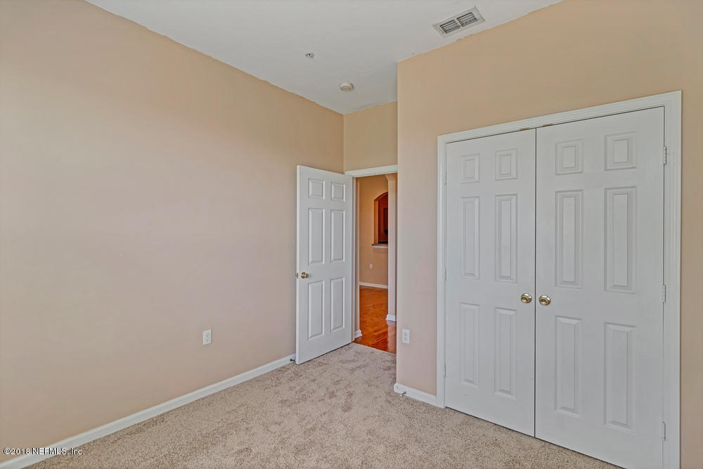 7990 Baymeadows Road East, Unit 211 Jacksonville, FL 32256 - Photo 16 of 21 an empty room with closet