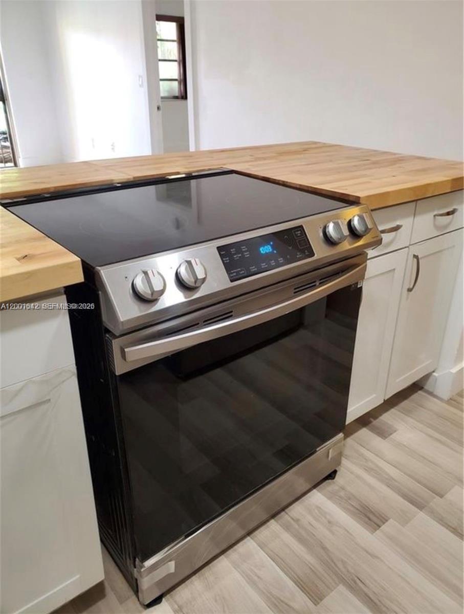3181 Southwest 13th Street, Unit 108 Miami, FL 33145 - Photo 4 of 10 a close view of stove top oven