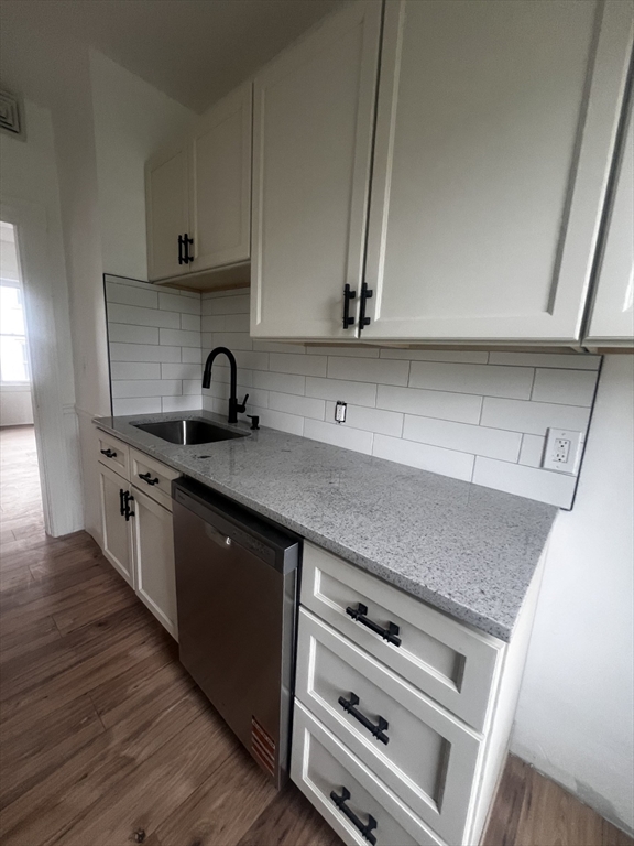 19 Reeves Street Worcester, MA 01607 - Photo 18 of 30 a kitchen with stainless steel appliances granite countertop a sink stove and cabinets