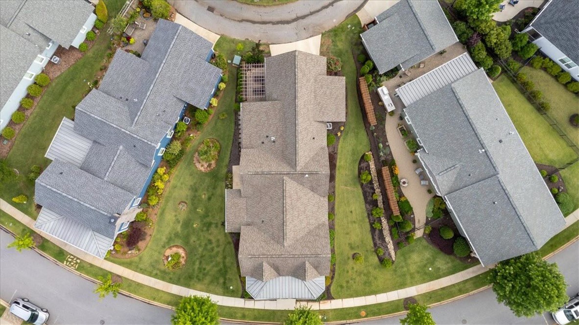 217 Pershing Avenue Clemson, SC 29631 - Photo 30 of 37 An aerial perspective reveals a cul-de-sac of homes nestled in a meticulously landscaped community, complete with private yards and mature greenery.