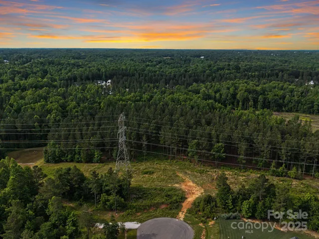 a view of a yard with a lake view