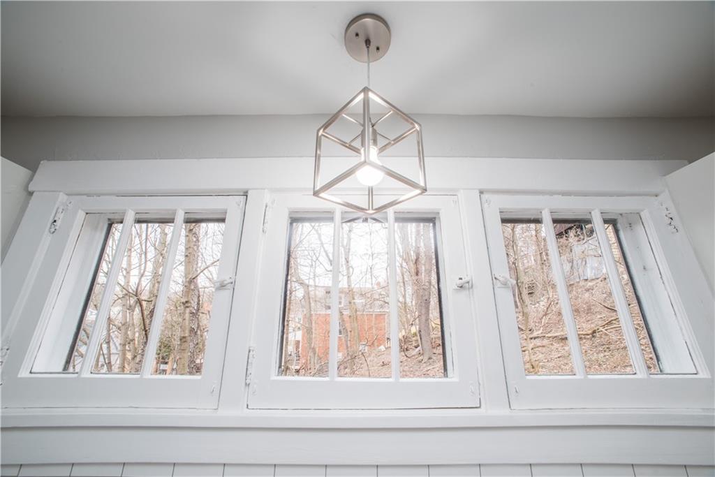 85 Pasadena Street Pittsburgh, PA 15211 - Photo 12 of 25 a view of a chandelier fan and wooden floor