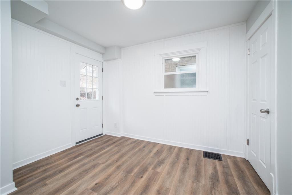 85 Pasadena Street Pittsburgh, PA 15211 - Photo 15 of 25 a view of an empty room with wooden floor
