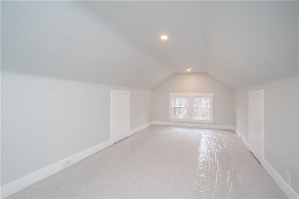 85 Pasadena Street Pittsburgh, PA 15211 - Photo 23 of 25 an empty room with a window and a chandelier fan