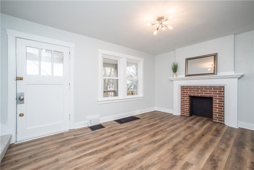 85 Pasadena Street Pittsburgh, PA 15211 - Photo 4 of 25 a view of an empty room with window and fire place