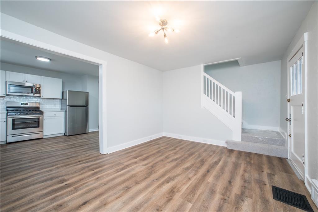85 Pasadena Street Pittsburgh, PA 15211 - Photo 7 of 25 a view of a kitchen with a stove cabinets and wooden floor