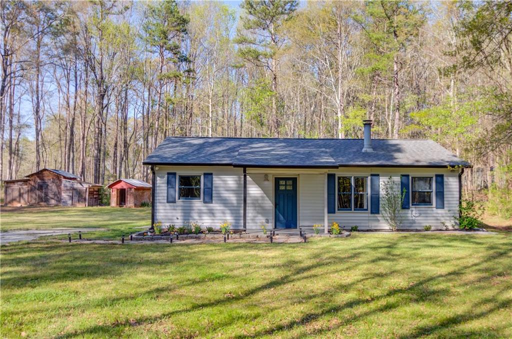 338 Bell Wood Road Jefferson, GA 30549 - Photo 1 of 1 a front view of house with yard and seating area