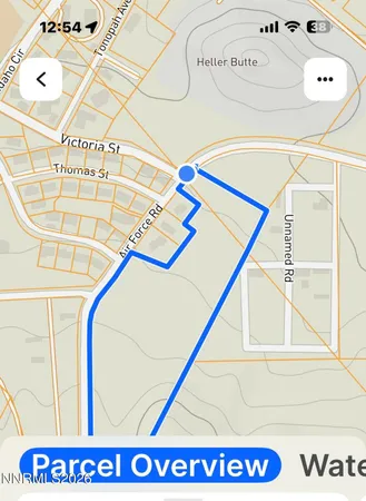 a street sign on a wall next to a road