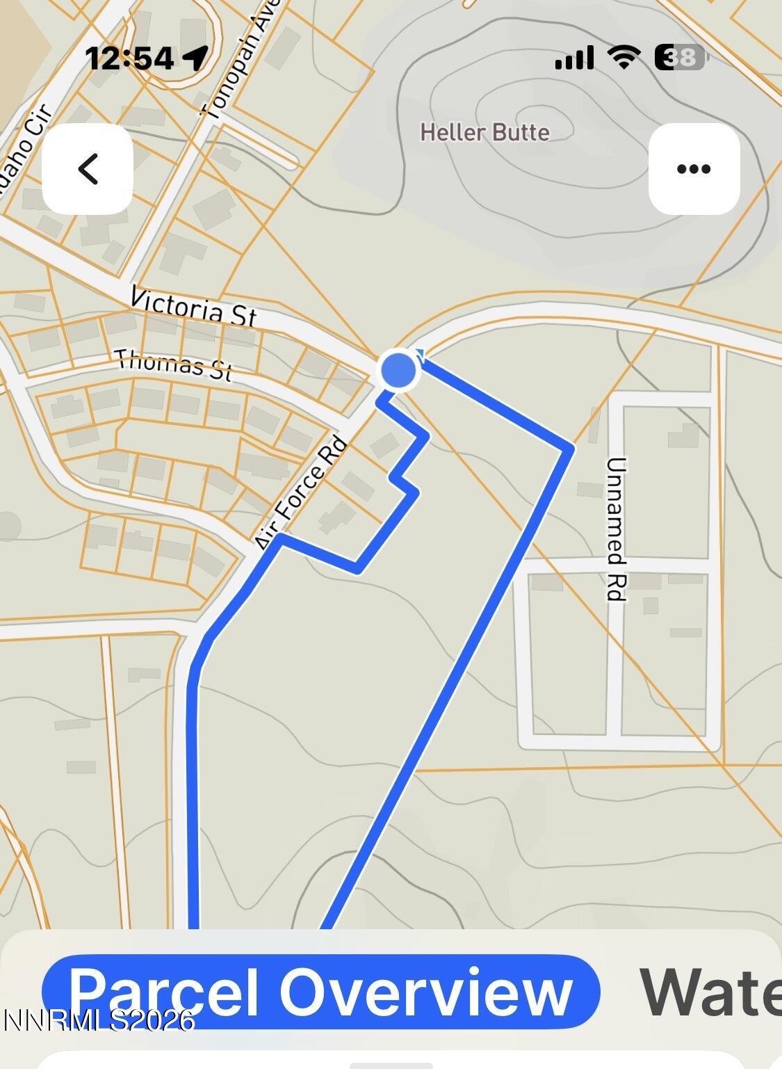 904 Air Force Road Tonopah, NV 89049 - Photo 1 of 8 a street sign on a wall next to a road