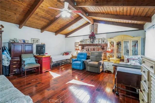 a living room filled with furniture and a chandelier