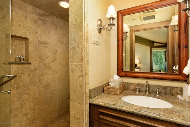 a view of a living room and entryway with furniture
