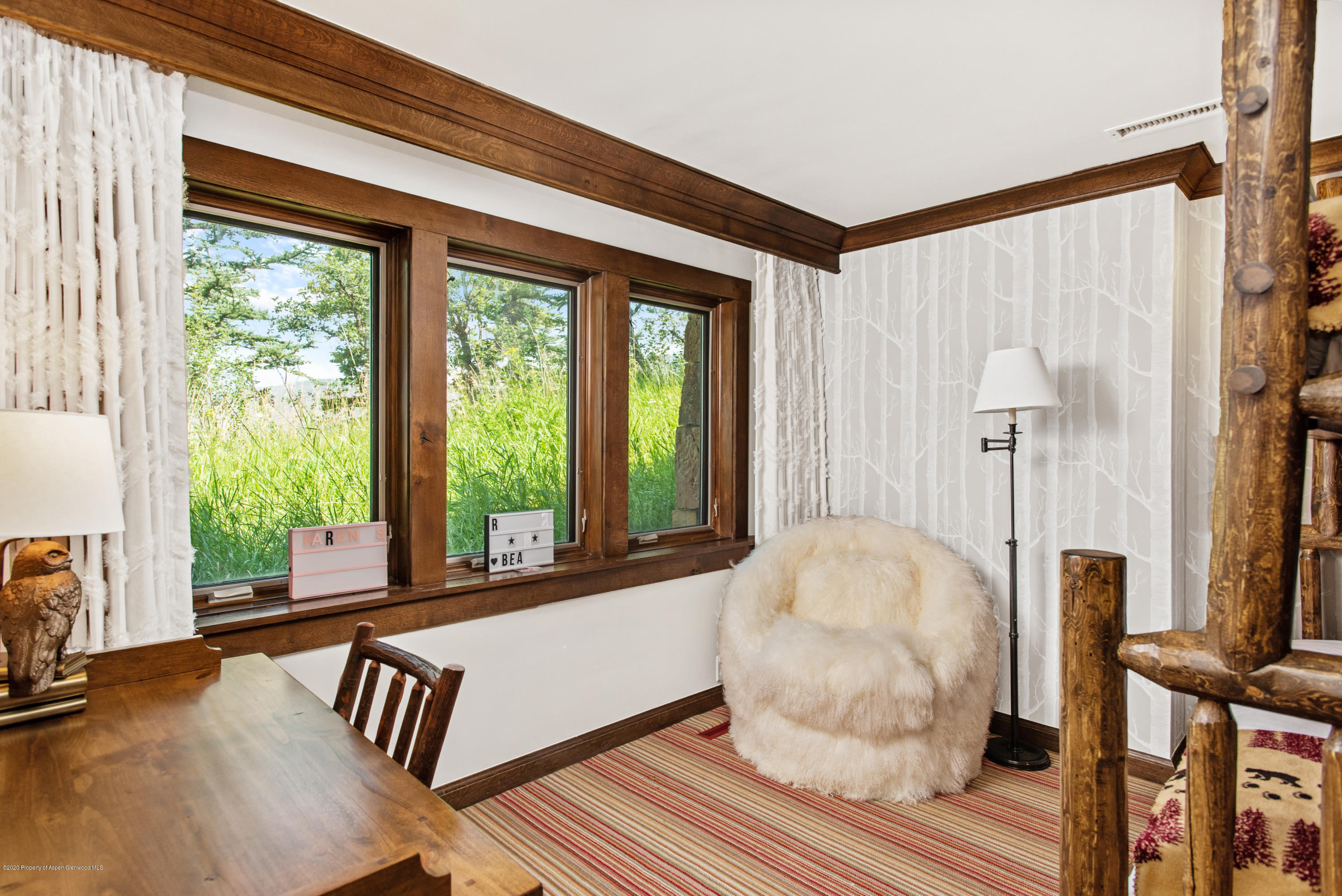 565 North Starwood Road Aspen, CO 81612 - Photo 22 of 50 a view of a livingroom with furniture and windows