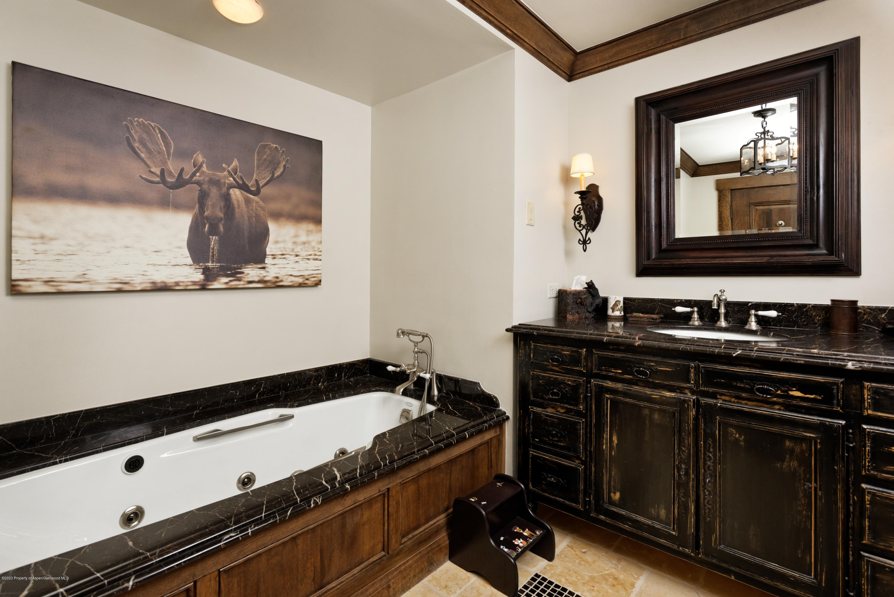 565 North Starwood Road Aspen, CO 81612 - Photo 23 of 50 a bathroom with a sink and a mirror