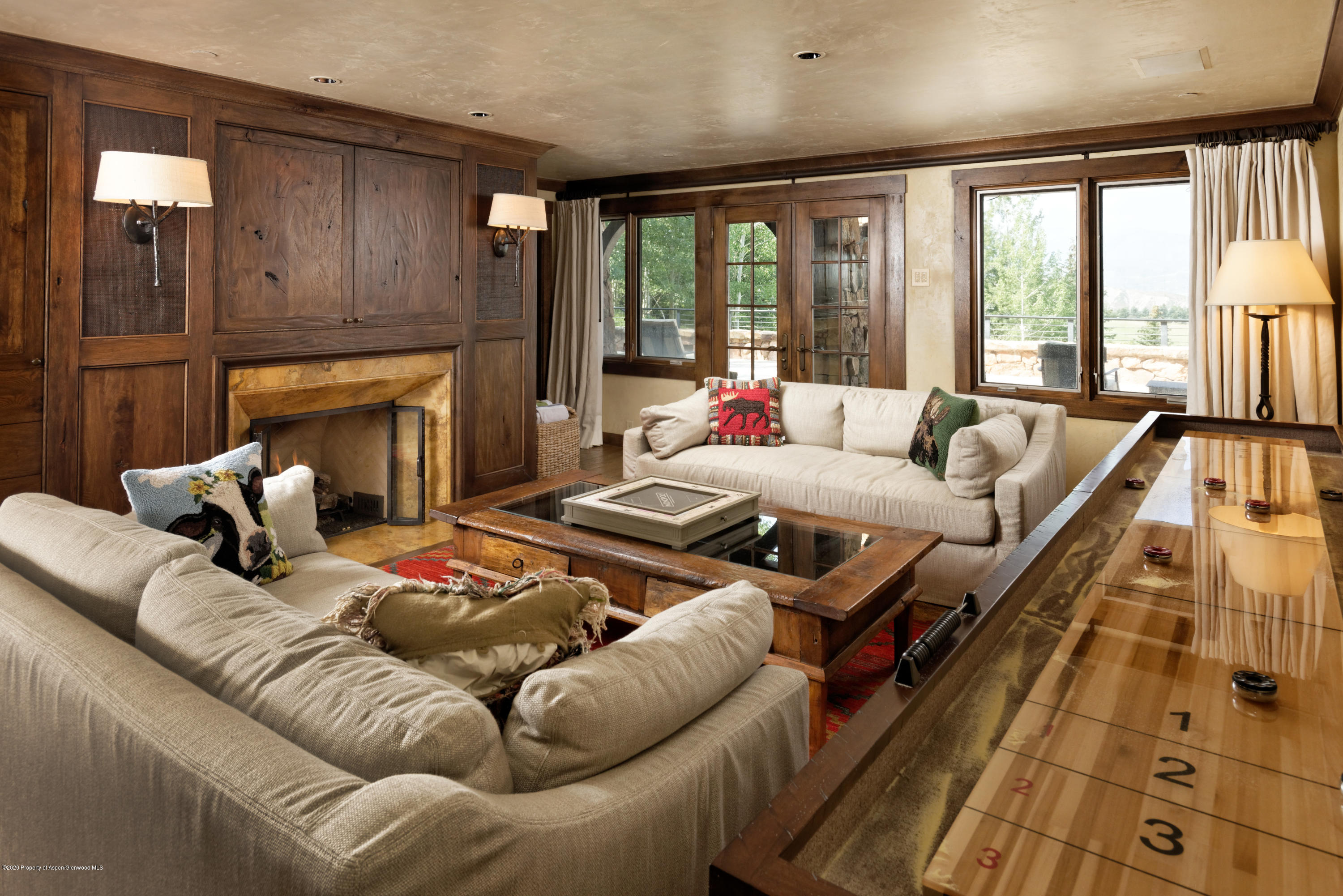 565 North Starwood Road Aspen, CO 81612 - Photo 25 of 50 a living room with furniture and a fireplace