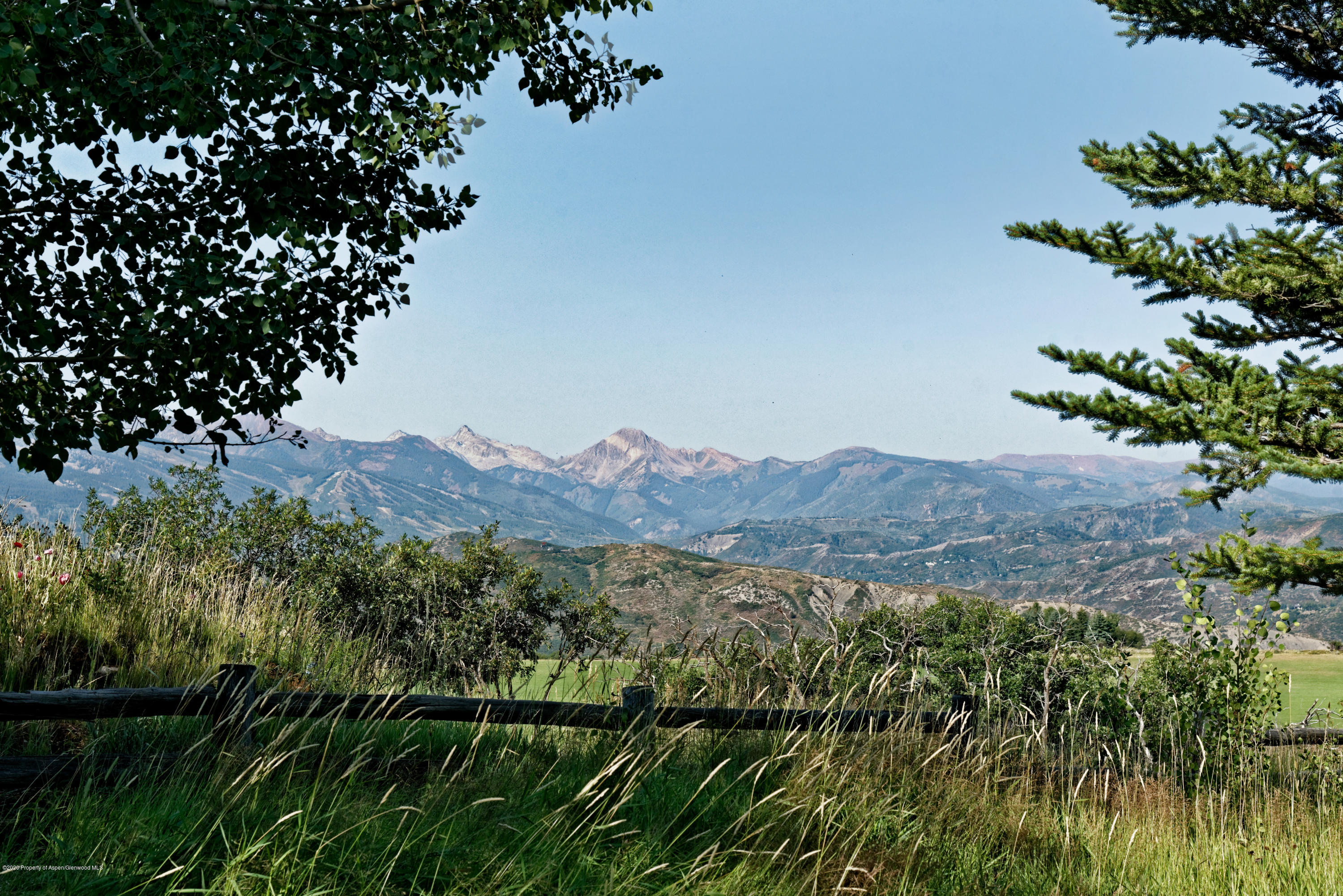 565 North Starwood Road Aspen, CO 81612 - Photo 30 of 50 a view of a lush green mountain with a mountain in the background