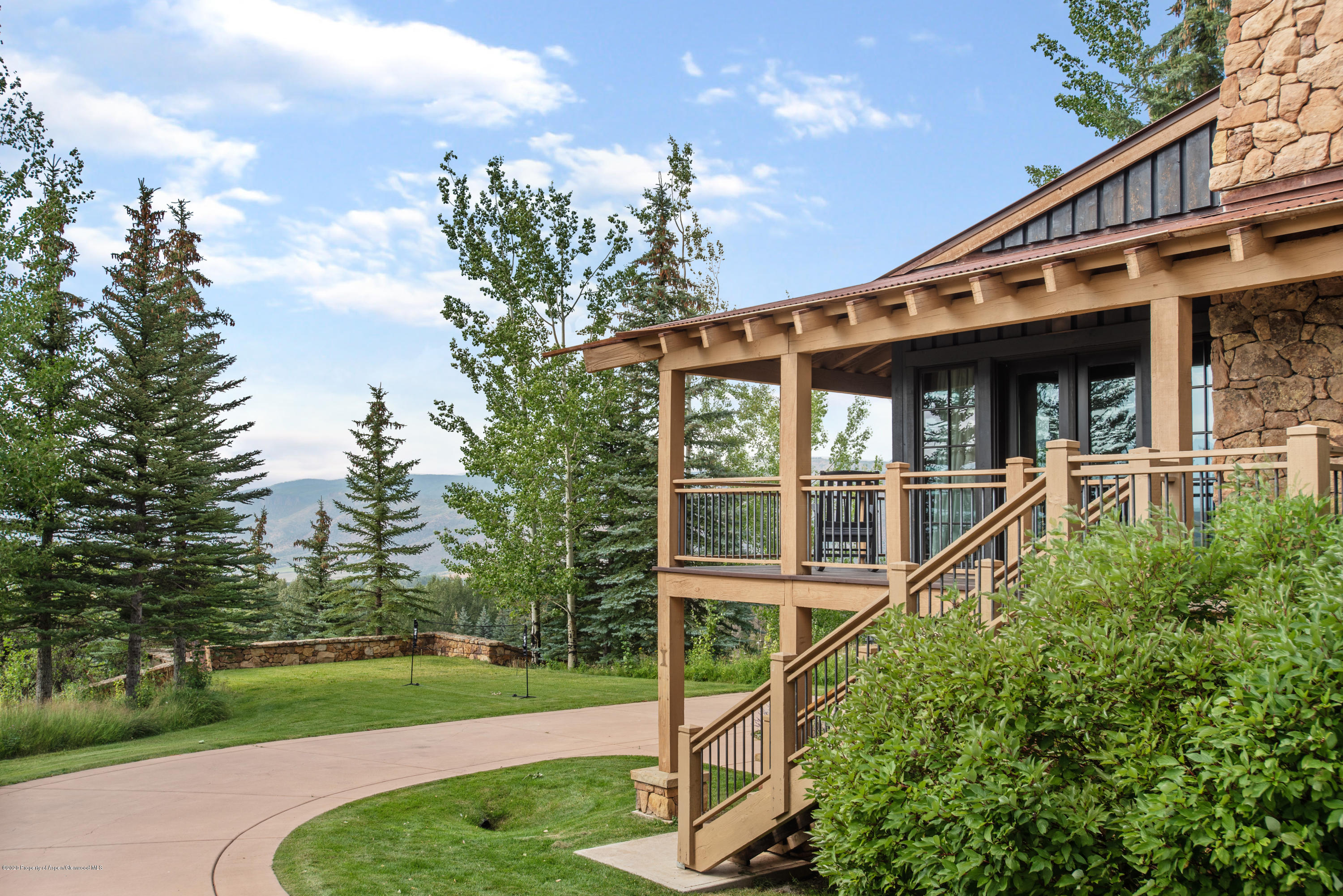 565 North Starwood Road Aspen, CO 81612 - Photo 43 of 50 a front view of a house with a yard