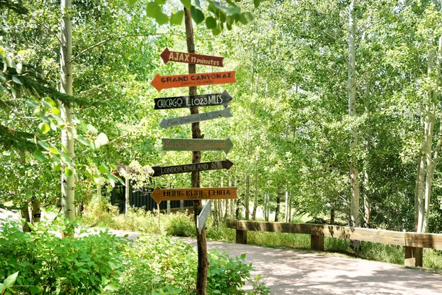 a view of backyard with deck and outdoor seating