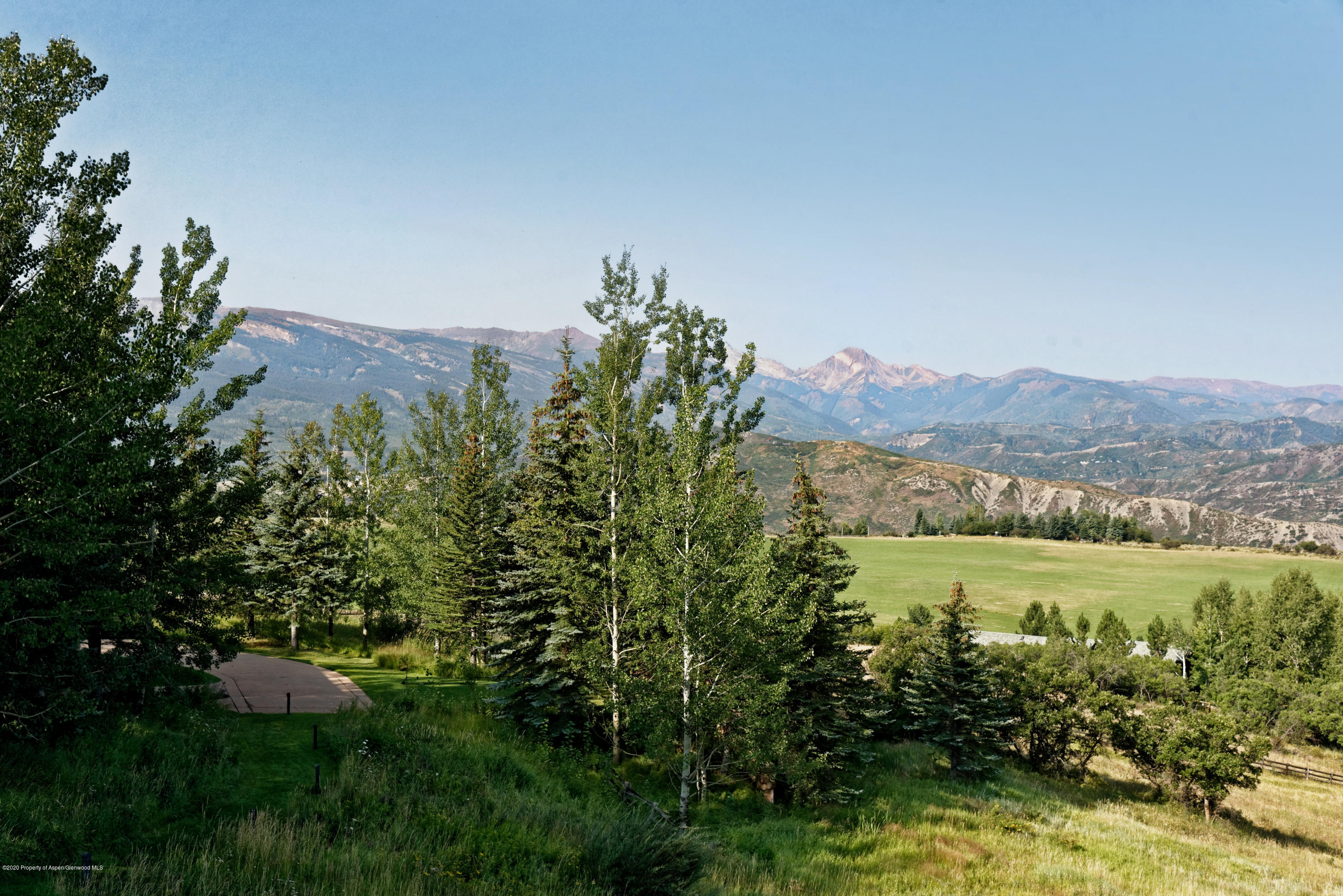 565 North Starwood Road Aspen, CO 81612 - Photo 49 of 50 a view of a yard with an outdoor space and seating