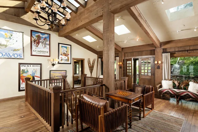 a view of a balcony with chair and table