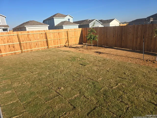 a view of a house with basketball court