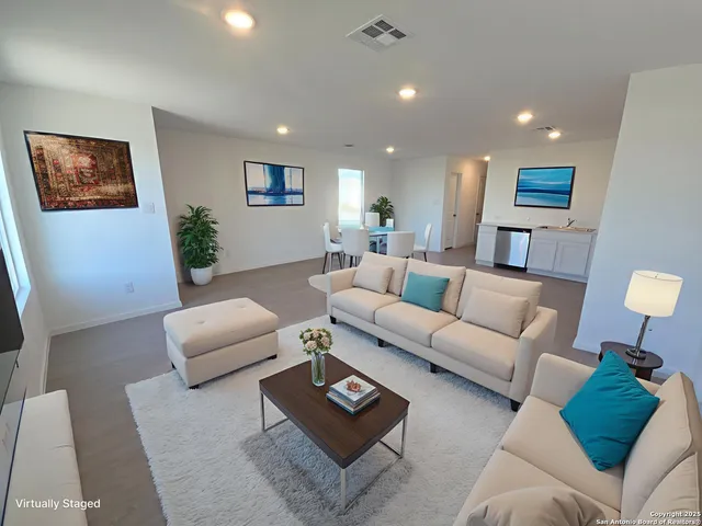 a living room with furniture and a couch