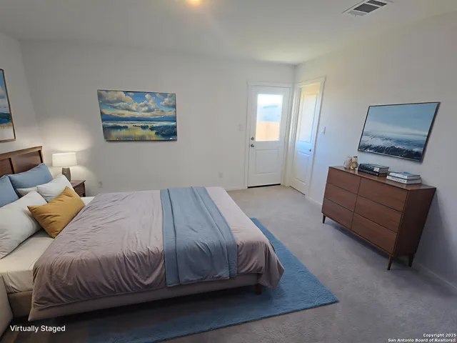 a bedroom with a bed and window