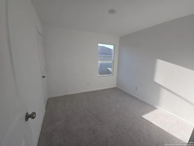 an empty room with a empty space and window