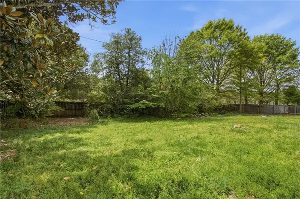 a view of outdoor space with deck and yard