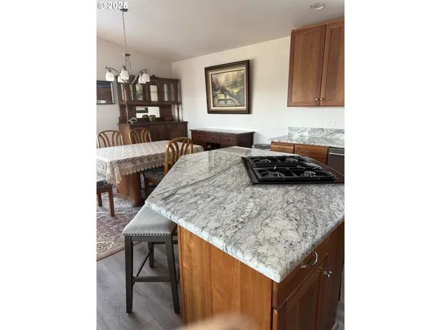 a kitchen with a table and chairs