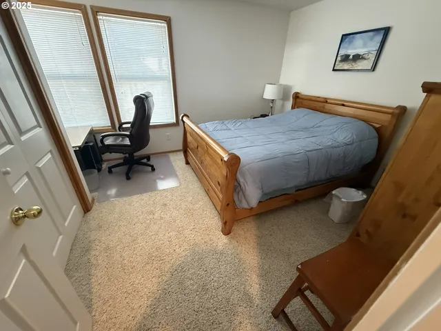a bedroom with a bed and furniture