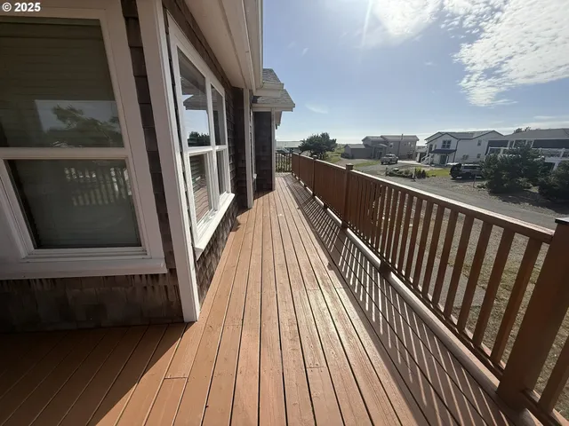 a view of balcony with wooden floor