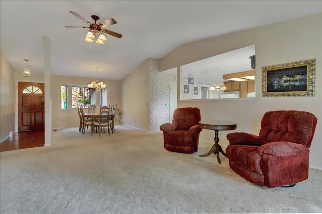 a view of a dining room with furniture window and outside view