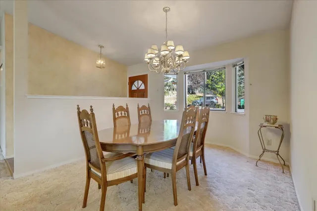 a dining room with furniture and window
