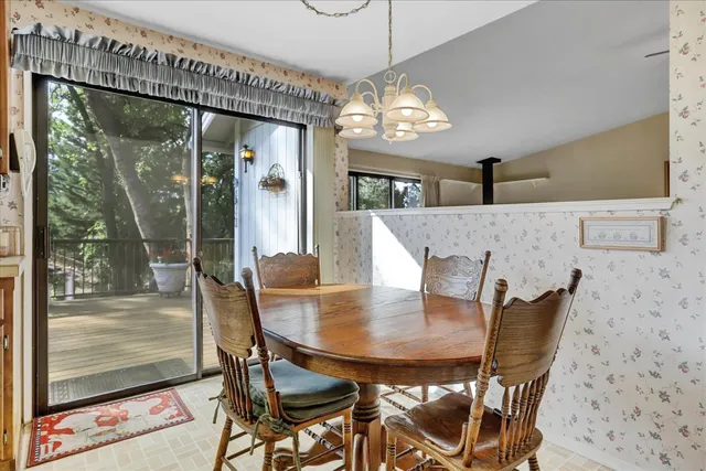 a kitchen with kitchen island granite countertop a sink stove and refrigerator