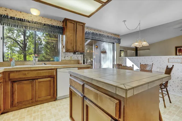 a view of room with window and a ceiling fan