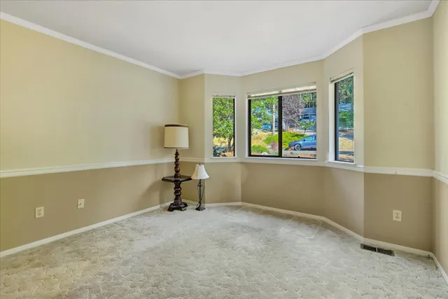 a small bedroom with a bed and a cabinets
