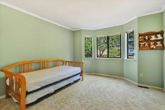 a bedroom with a bed and a cabinets