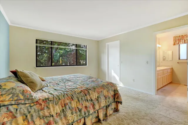 a view of a balcony with wooden floor and fence