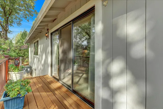 a view of a small house in the middle of a yard