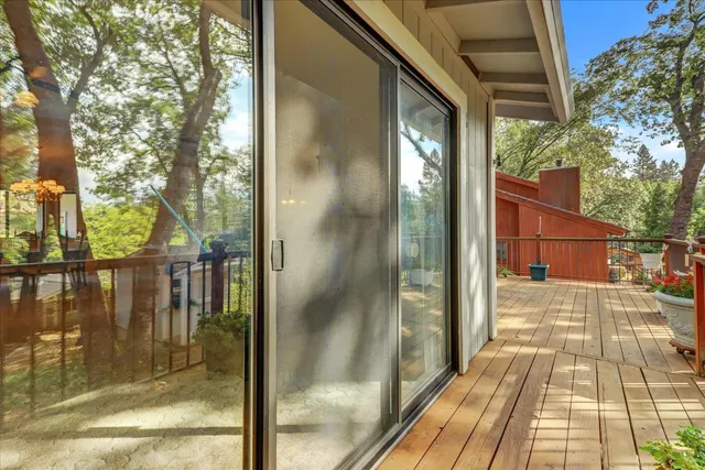 a front view of house with a garden