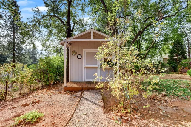 a front view of a house with garden