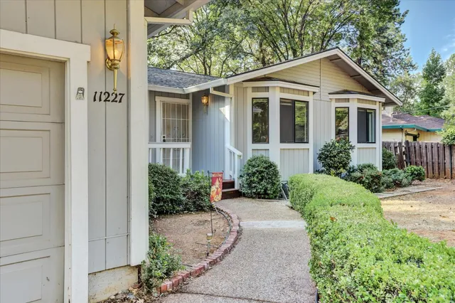 a view of porch with a bench and yard