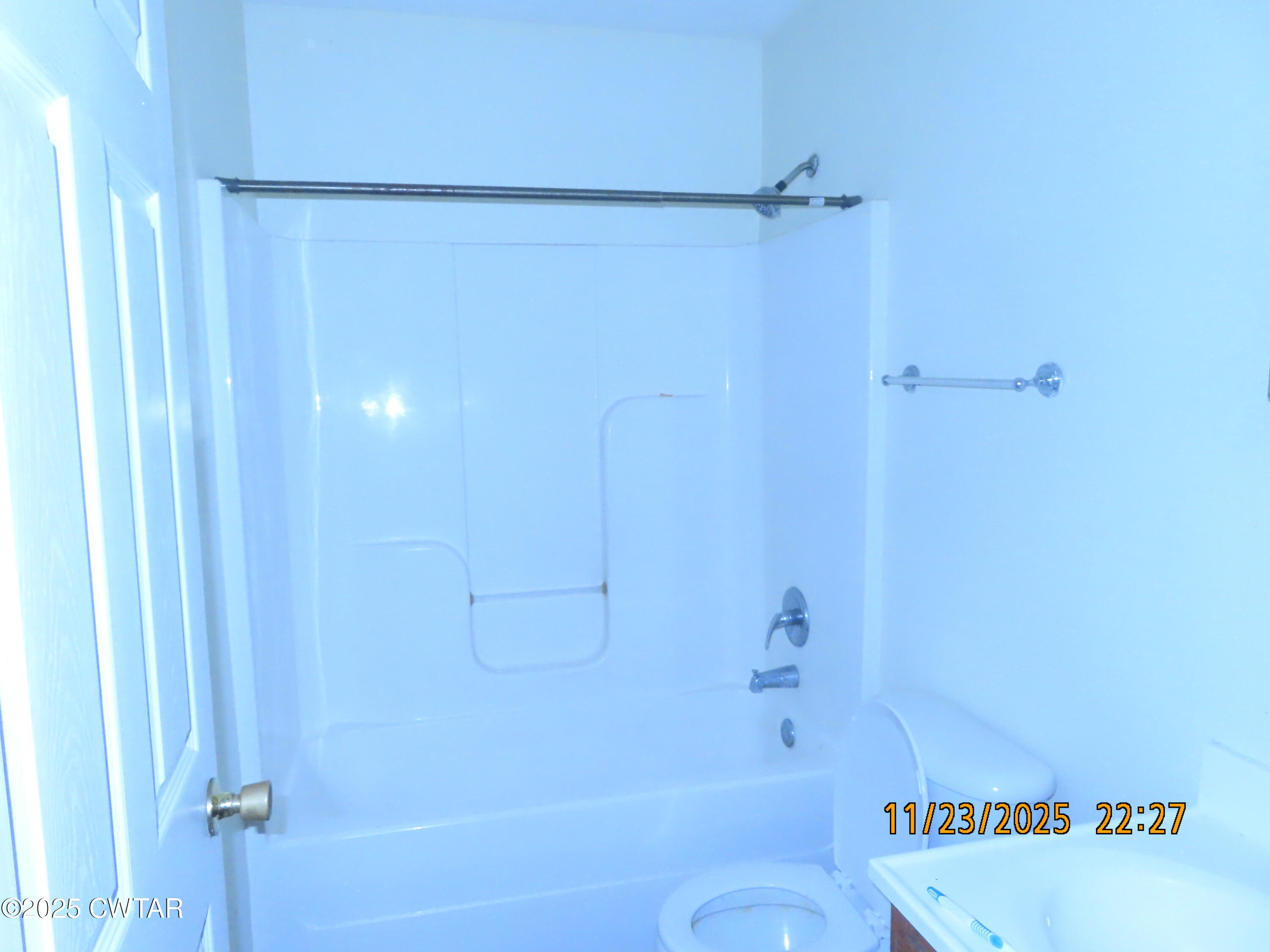 111 Rhea Street Jackson, TN 38301 - Photo 14 of 24 a bathroom with a shower and a toilet