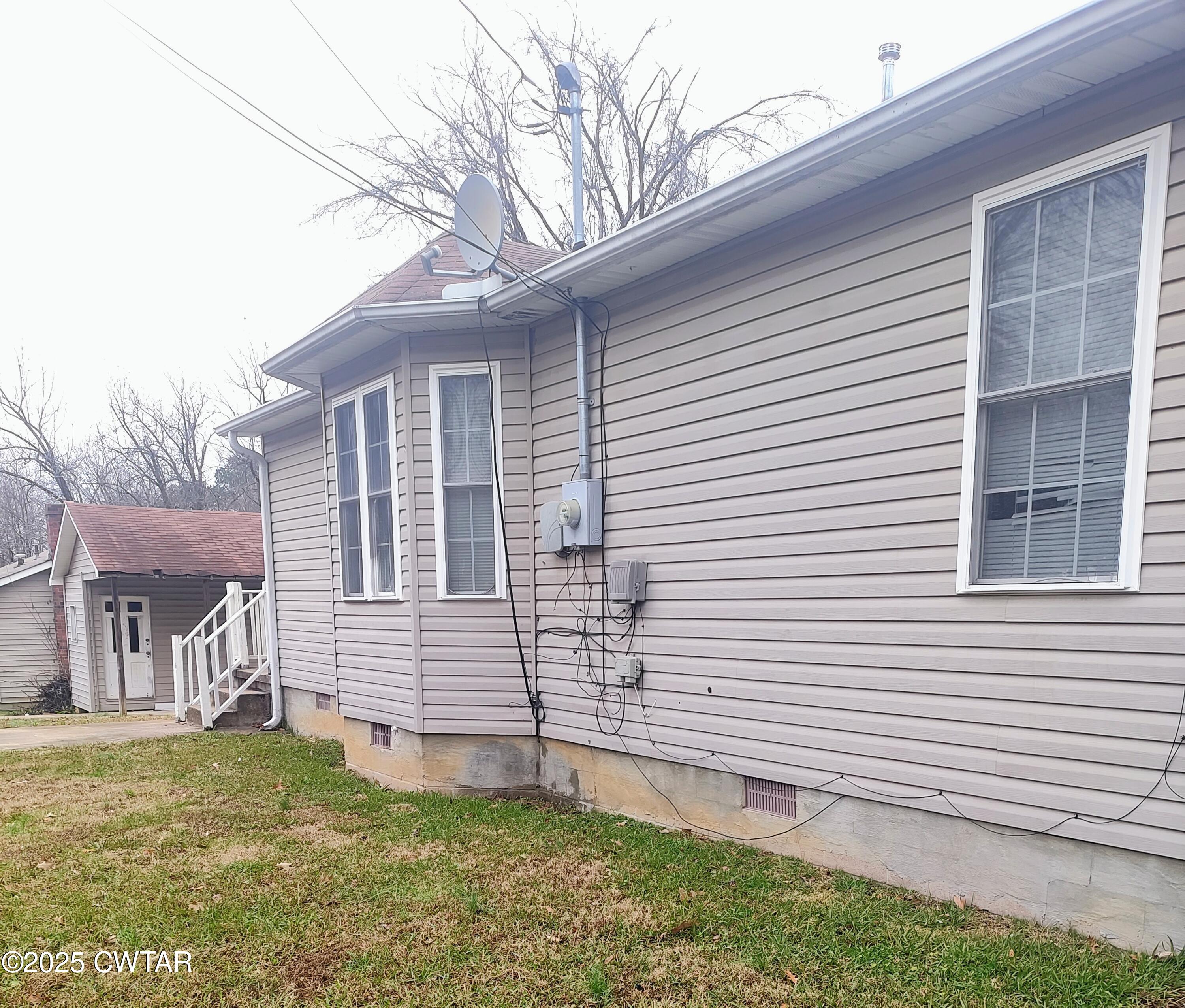 111 Rhea Street Jackson, TN 38301 - Photo 24 of 24 a view of a house with a yard and an outdoor space